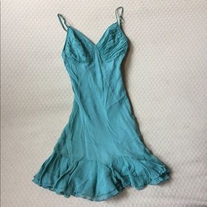 Flirty silk dress with adjustable straps.